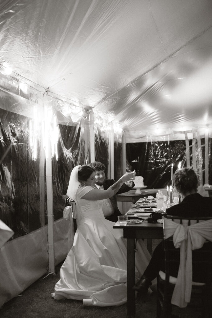 Bride and groom toast at a wedding reception