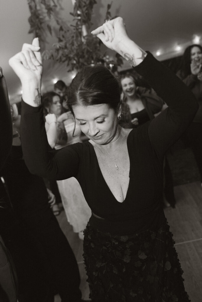 Woman dancing joyfully at a party
