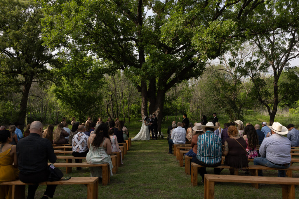 Outdoor wedding ceremony in a wooded setting