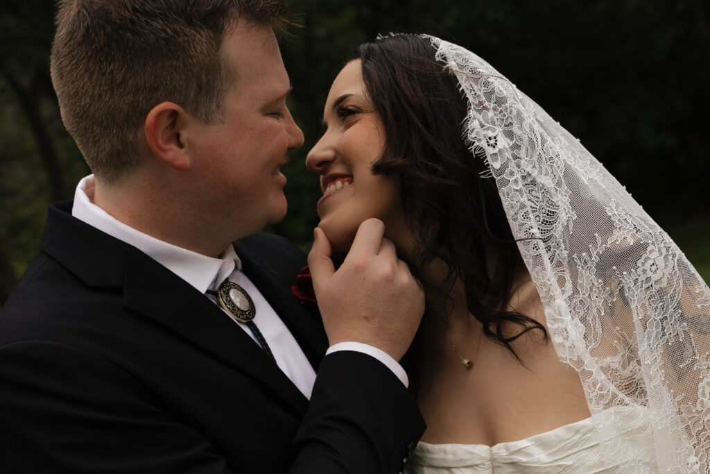 Bride and groom sharing a tender moment close up