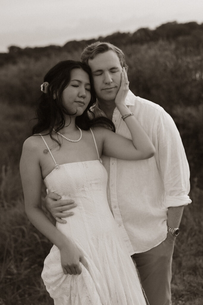 Couple embracing in a serene outdoor setting