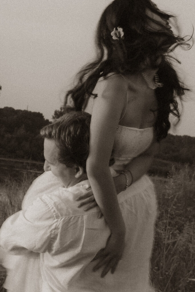Romantic lakeside engagement moment at sunrise